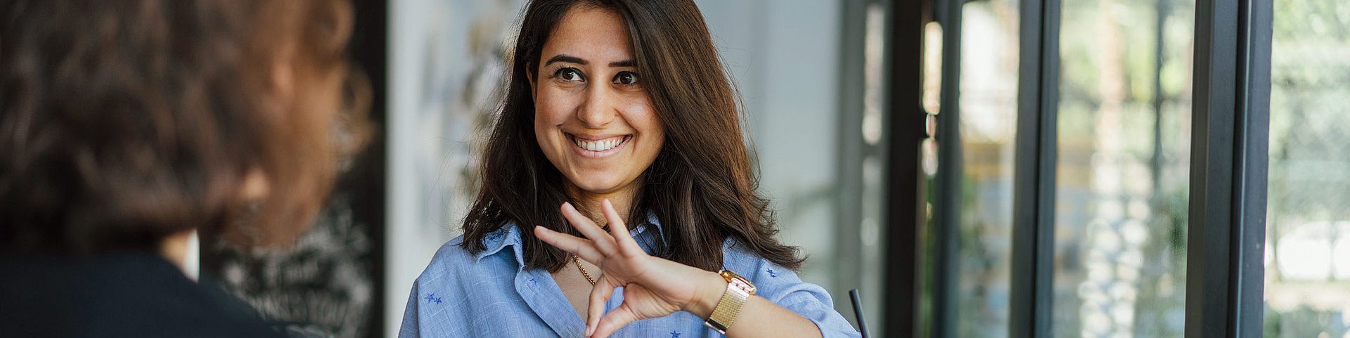 Woman communicates using sign language