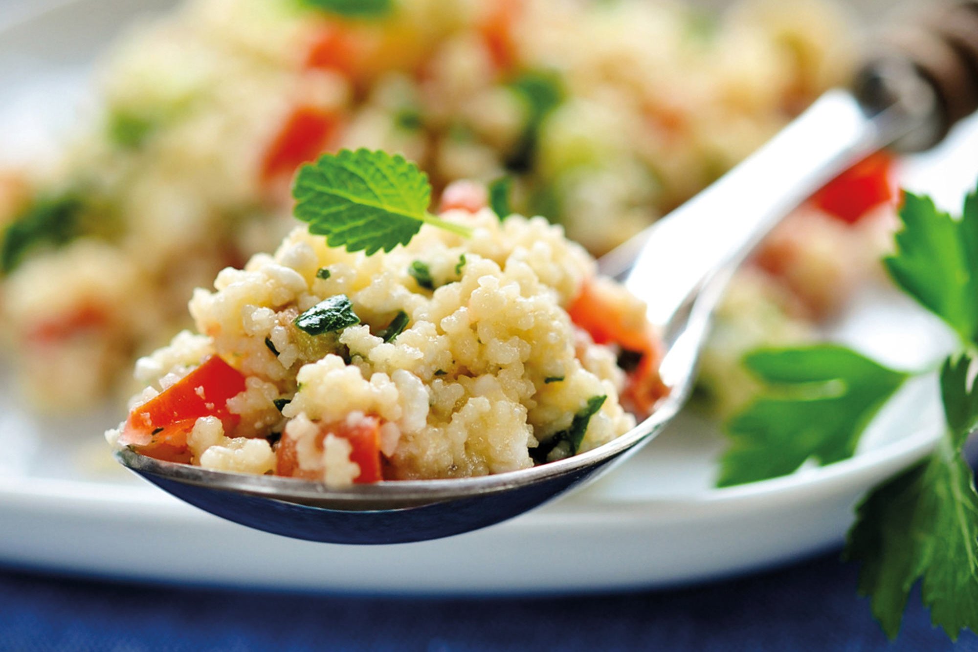 Colourful bulgur salad on a spoon at Café Jungiusstraße