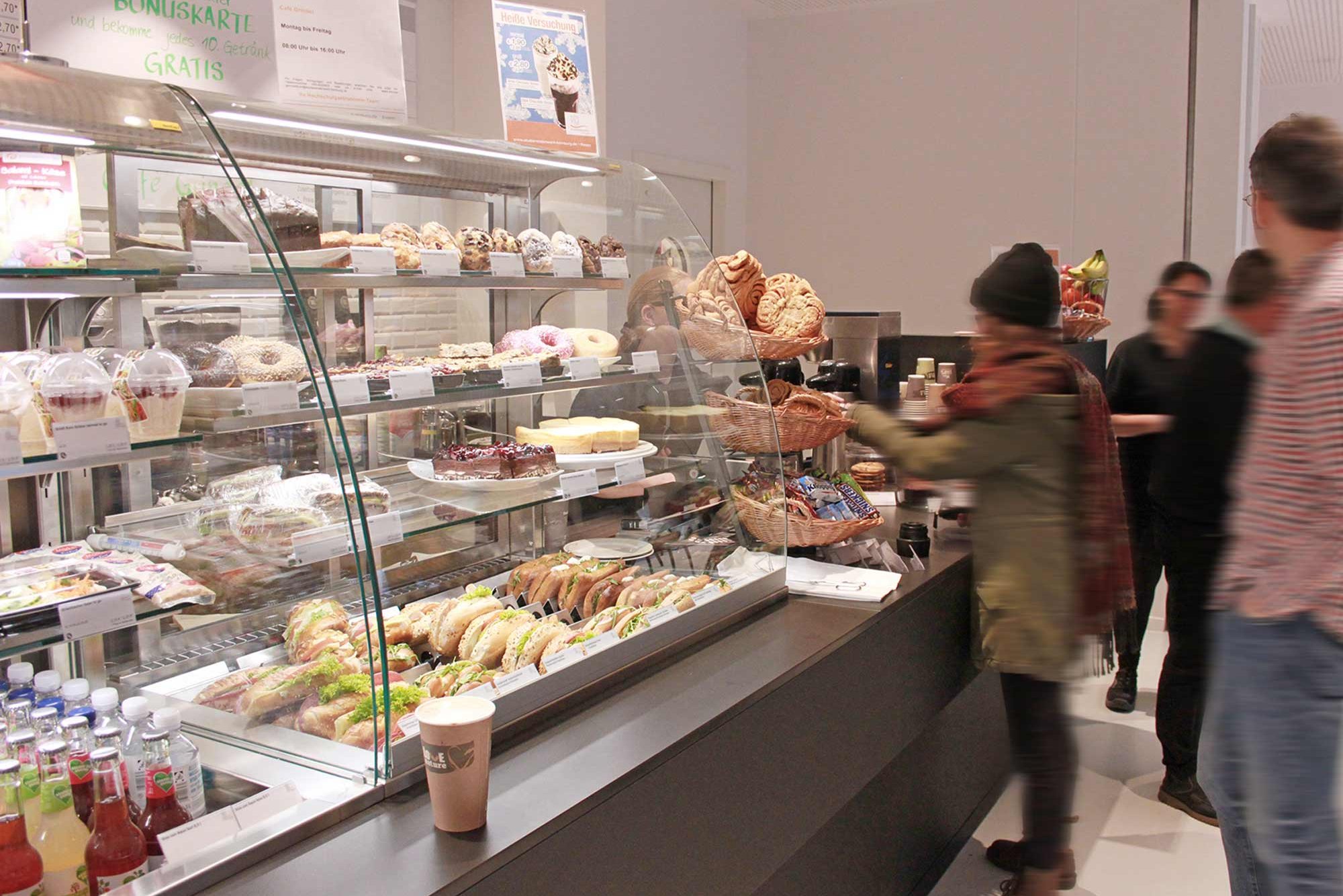 Sales counter with guests at Café Grindel