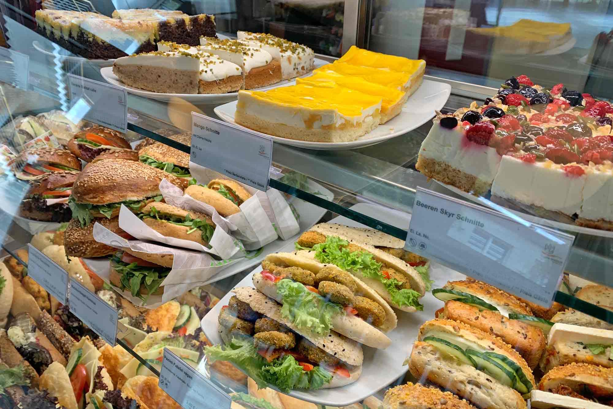 Display case with cakes,bagels and sandwiches at Café Jungiusstraße