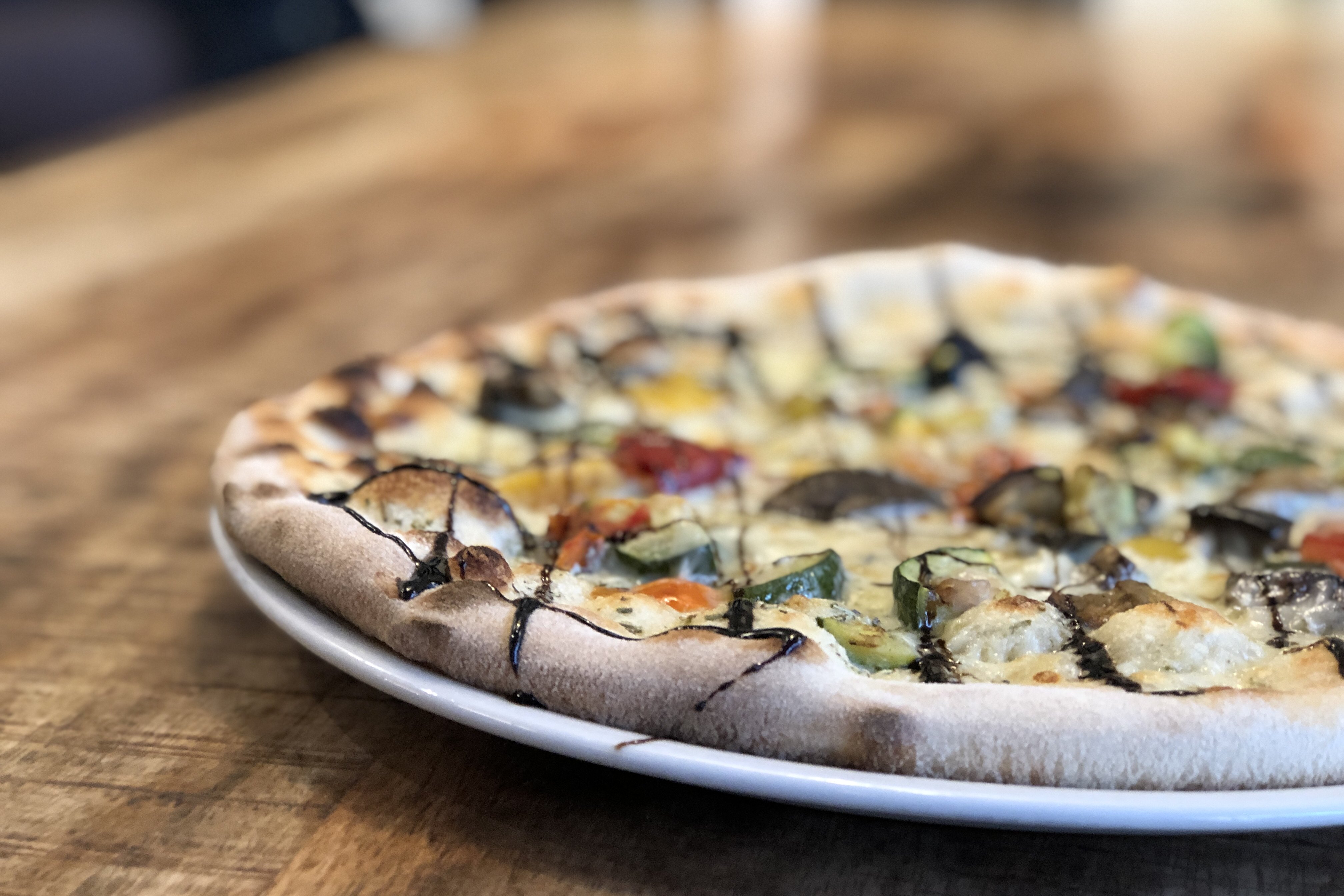 Pizza on a plate at Schlüters