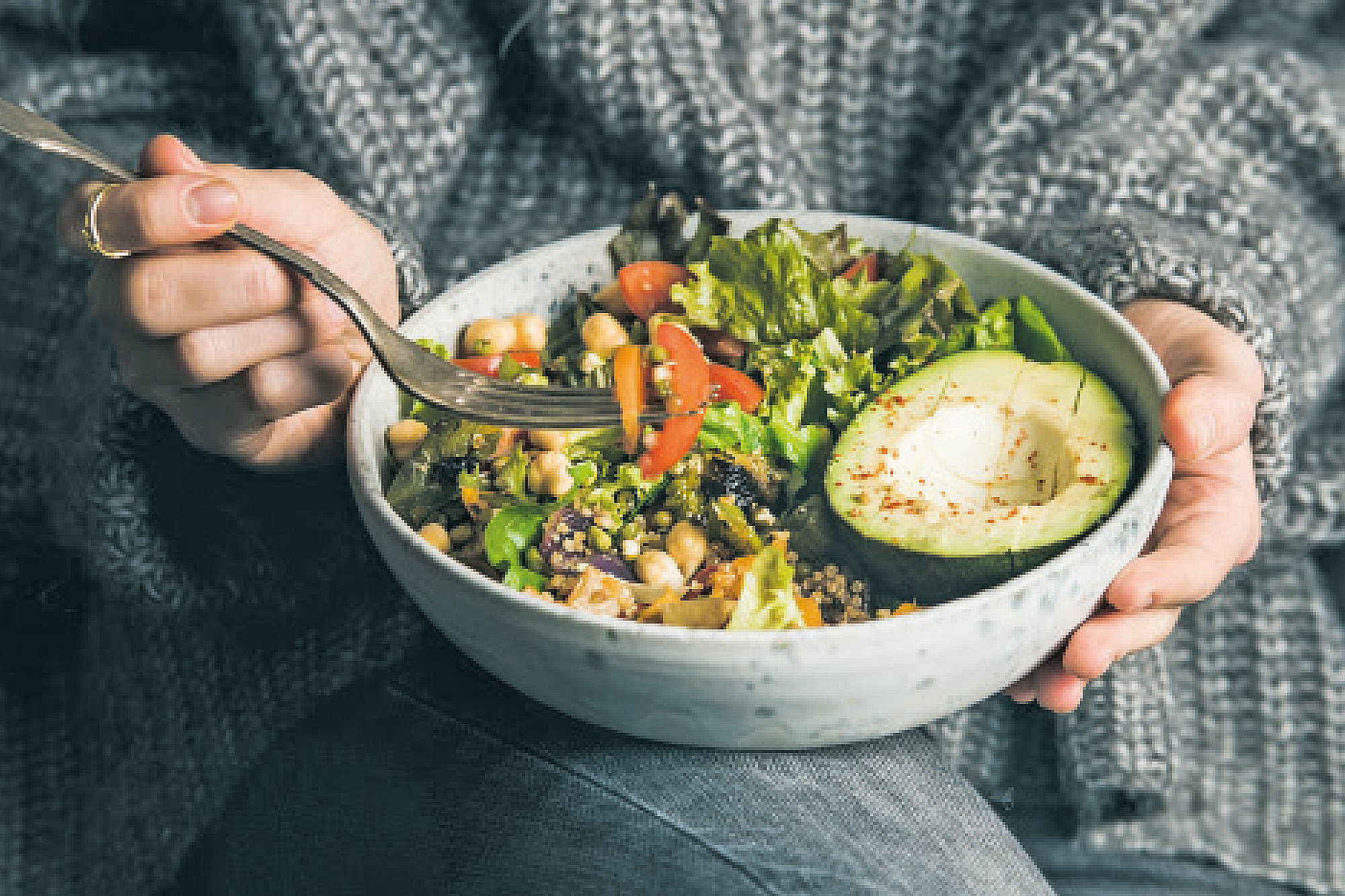 Woman eating from a bowl