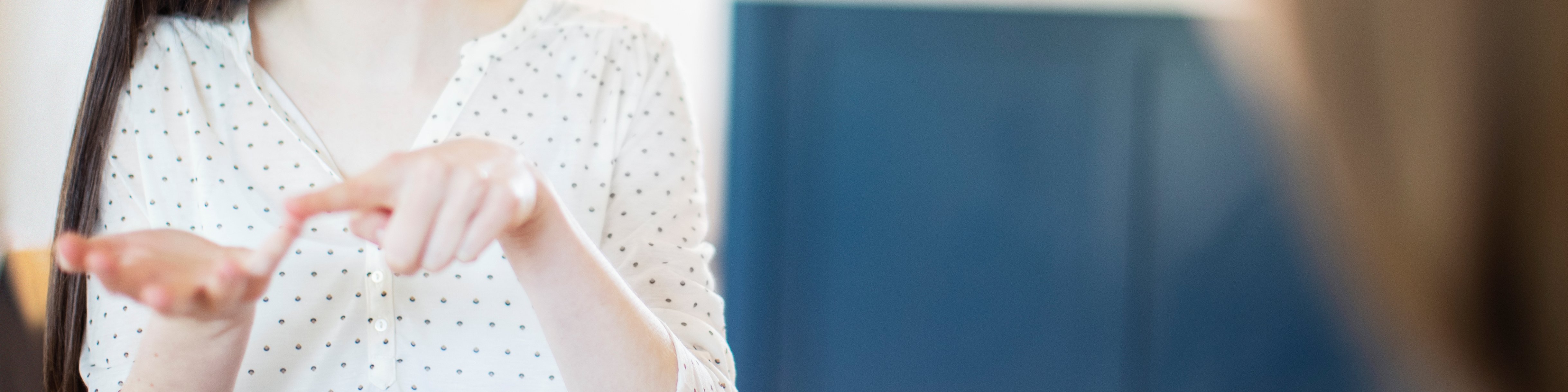 Young woman communicating in sign language