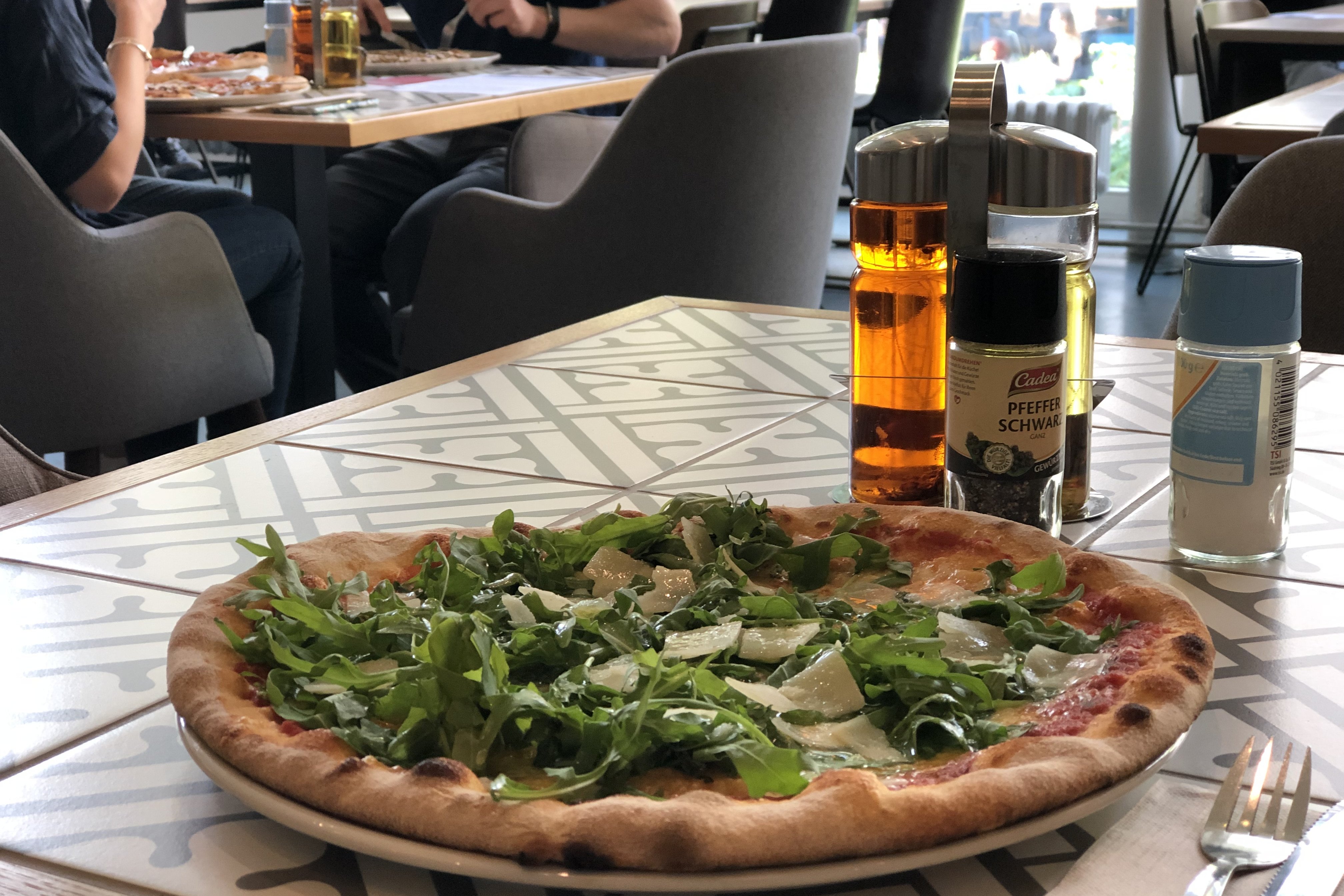 Pizza on a plate at Schlüters