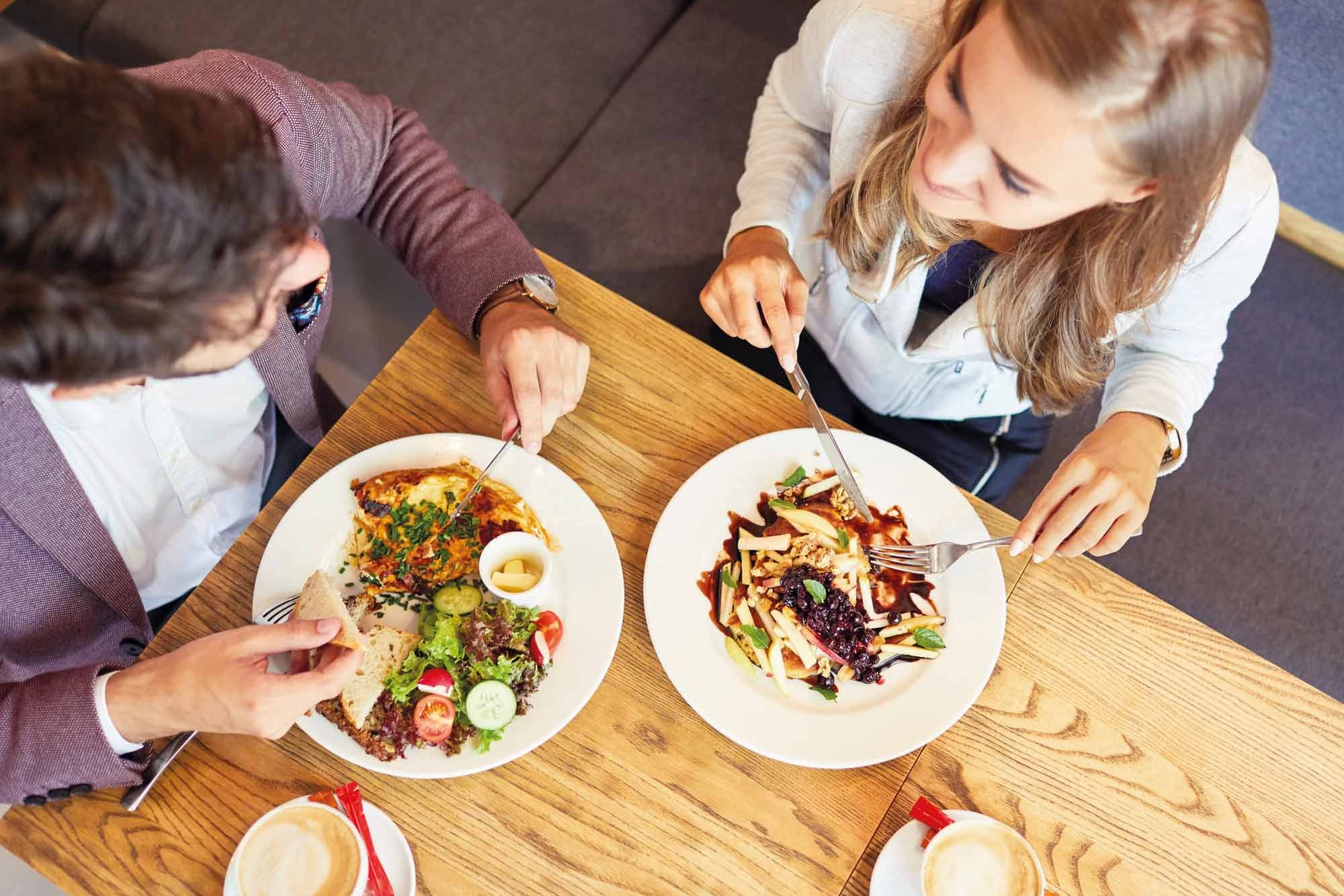 Two students in the HCU cafeteria, view from above