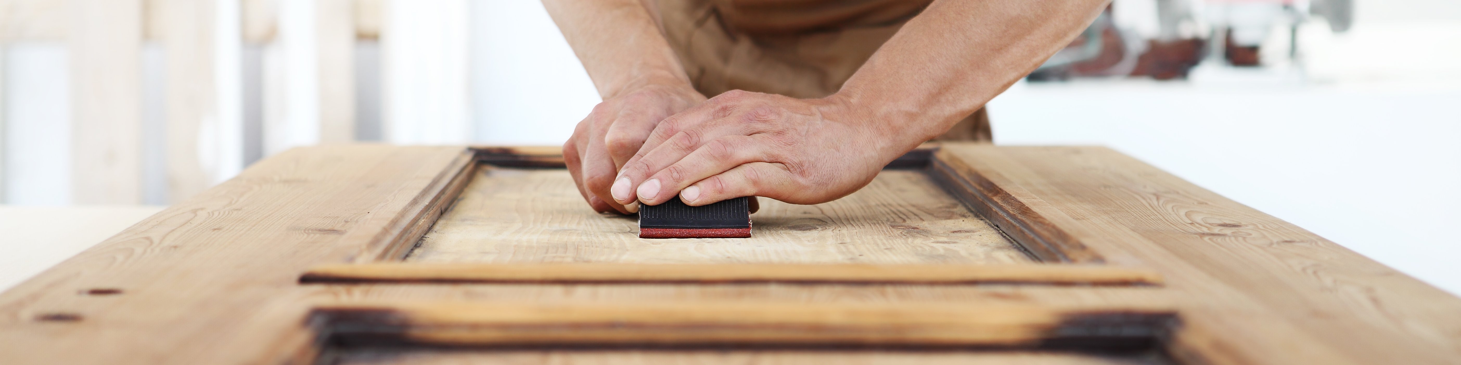 Carpenter sanding wood