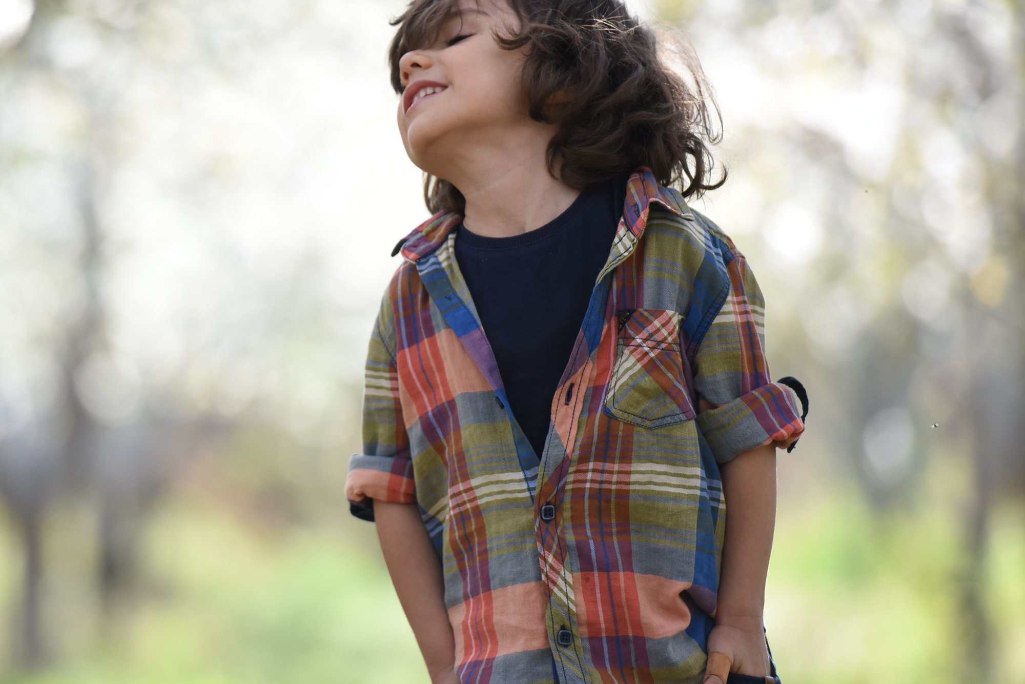 Boy of kindergarten age, outside in the garden