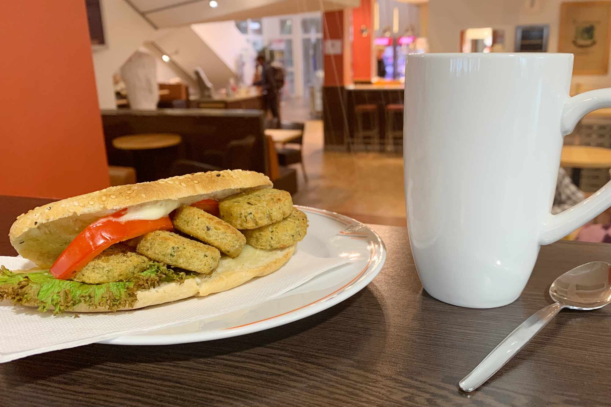 Coffee and a panini on a plate 