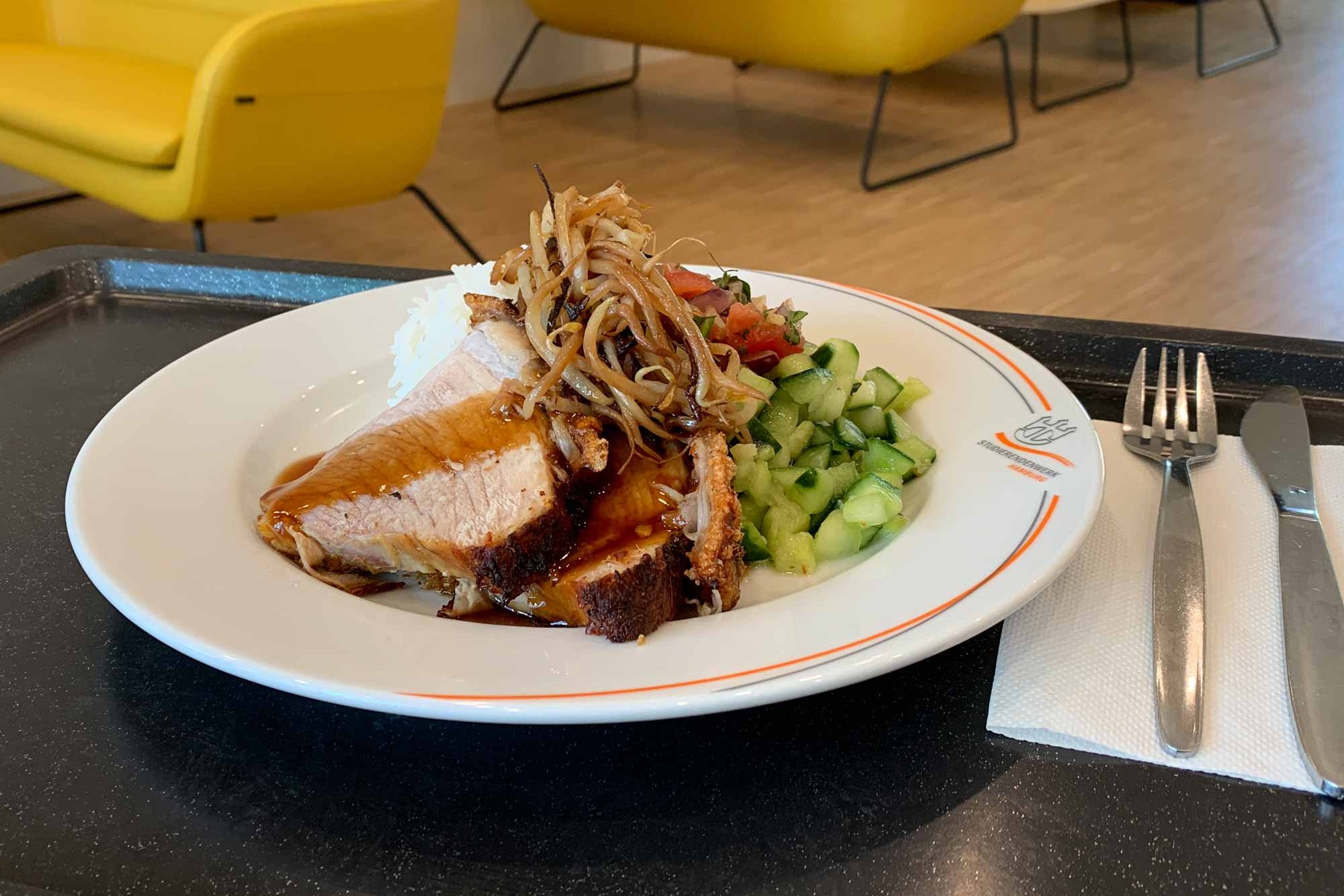 Roast pork with side dishes on a plate